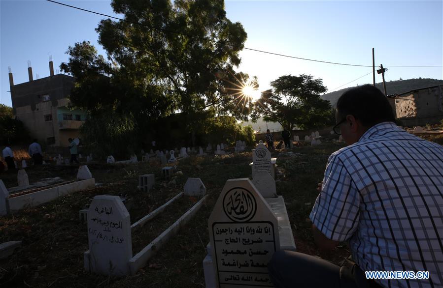 MIDEAST-NABLUS-CEMETERY-EID AL-FITR