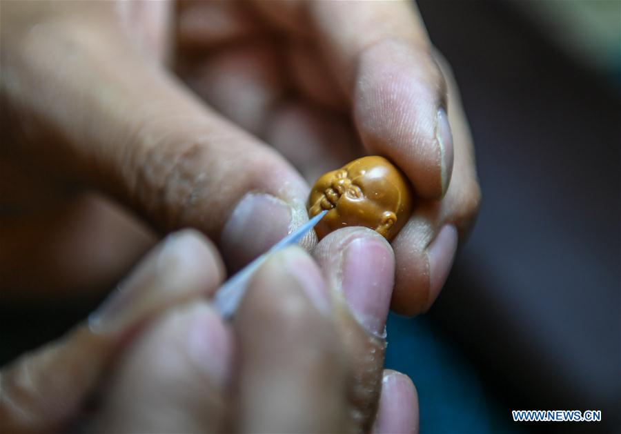 CHINA-INNER MONGOLIA-CHIFENG-FRUIT PIT-CARVING (CN)