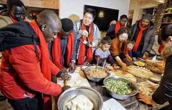 Foreigners participate in cultural event to greet Chinese New Year in Beijing